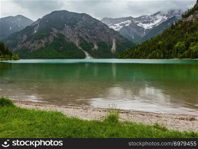Plansee Alps mountain lake summer overcast day view, Tyrol, Austria.