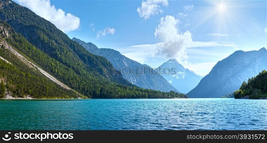 Plansee lake summer panorama with snow on mount top (Austria).