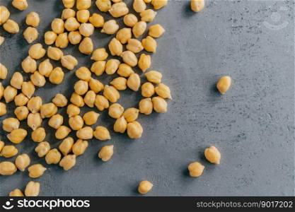 Plant based protein. Raw fresh chickpeas on grey background. Organic food. Ready to eat. Healthy nutrition concept. Ingredient for vegetarian dish