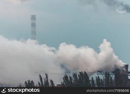 Plant with smoke. Air pollution and environment protection concept.