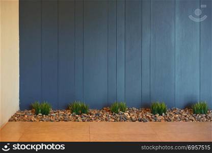 Plants and stones with blue wood background, interior decoration