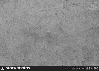 Plastered grey wall surface as a seamless background