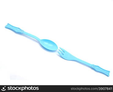 Plastic baby spoon on a white background