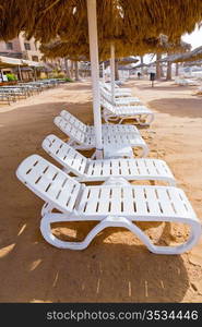 plastic beach beds on coral bay in Aqaba, Jordan