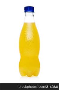Plastic bottle of orange soft soda drink on white background