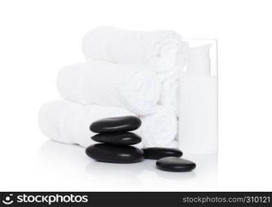 Plastic bottle of organic shampoo with spa towels and stones on white background
