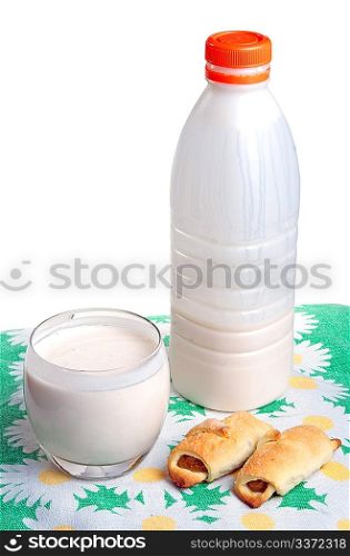 Plastic bottle with clabber, glass and bagels on tablecloth with cliping path