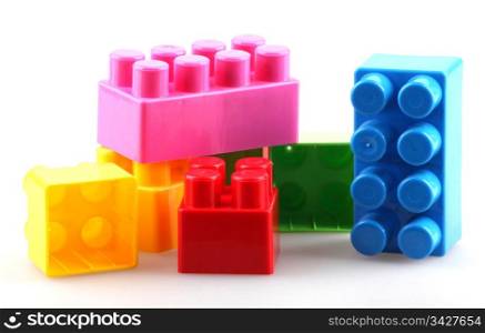 Plastic building blocks isolated on white background.