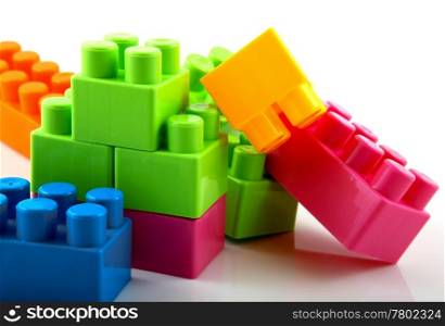 Plastic building blocks on a white background