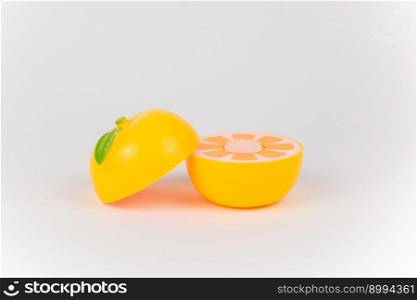 plastic children&rsquo;s toy orange on a white background. a plastic children&rsquo;s toy orange on a white background