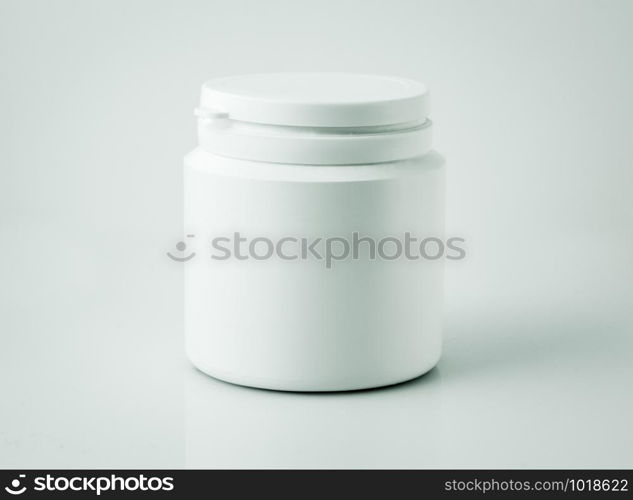 Plastic drug pills bottle isolated on grey background. Plastic drug pills bottle