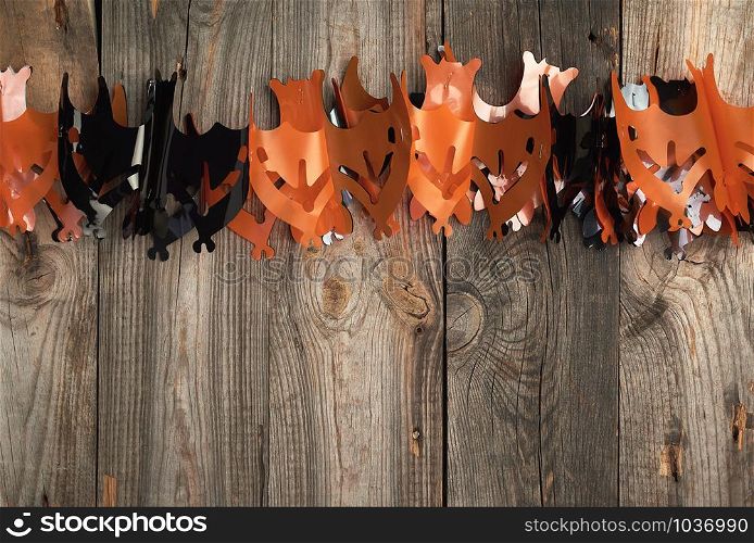 plastic garland on with bat figures, backdrop for Halloween