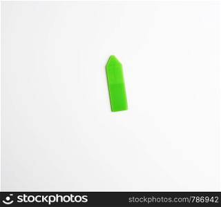 plastic green velcro bookmark for paper on white background, copy space