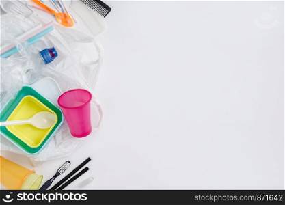 Plastic items on white background, flat lay.Plastic pollution affecting ecology. Environment concept. Top view.