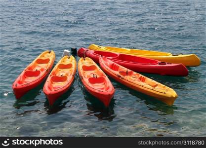 Plastic kayaks on the water