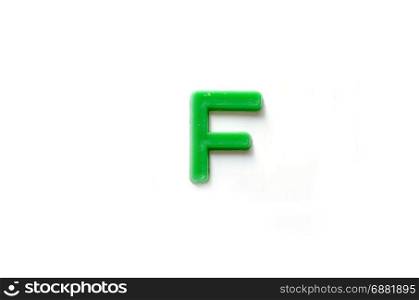 Plastic letters F isolated white background.