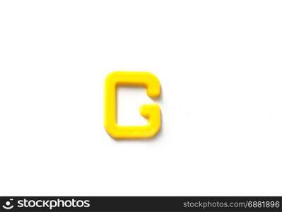 Plastic letters G isolated white background.