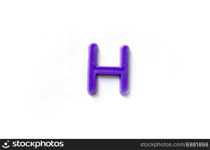 Plastic letters H isolated white background.