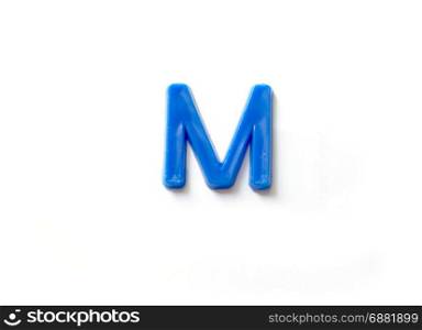 Plastic letters M isolated white background.