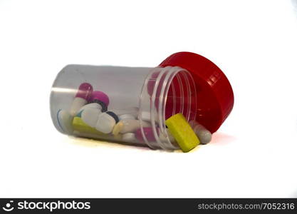 Plastic medicine box . Plastic medicine box with a red lid on a white background