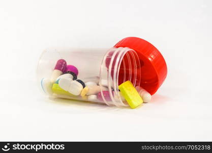 Plastic medicine box with a red . Plastic medicine box with a red lid on a white background