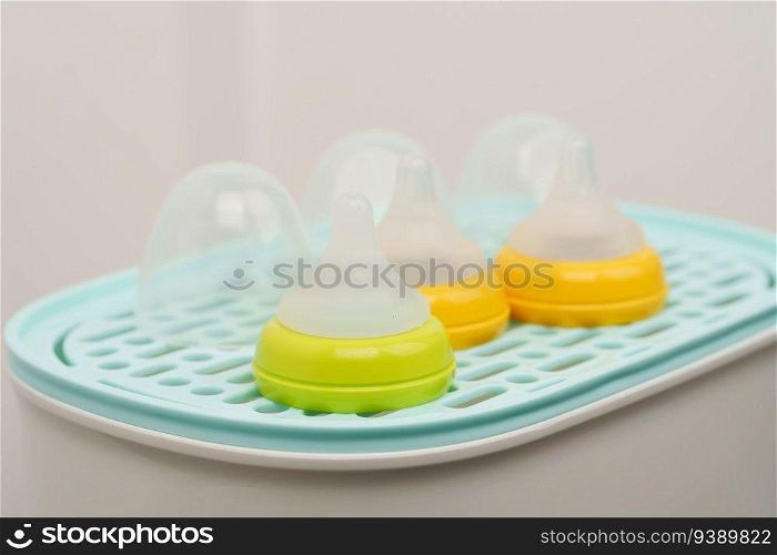 plastic nipple of the baby milk bottle on Steam sterilizer