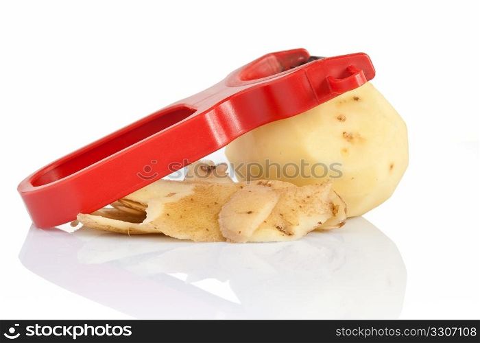 plastic potato pealer with peeled potato isolated
