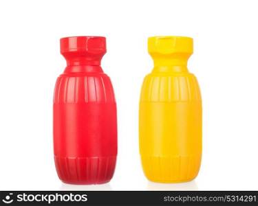 Plastic pots of mustard and ketchup isolated on blacno background