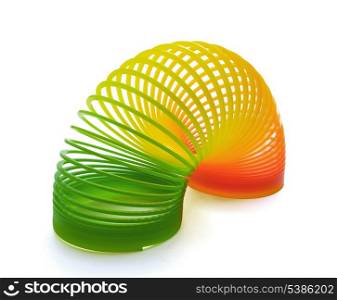 Plastic slinky spring toy isolated on white