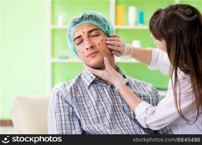 Plastic surgeon preparing for operation on man face