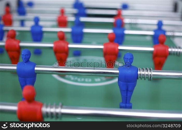 Plastic tabletop football with red and blue figures.