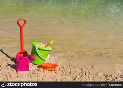 Plastic toys as bucket and shovel at the beach