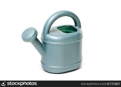 plastic watering can to water the plants in the garden
