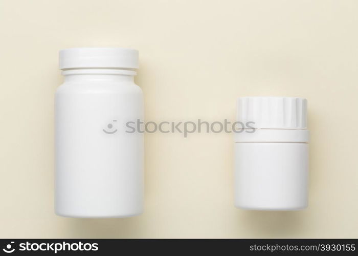 Plastic white medical bottle. Plastic medical bottle on a beige background