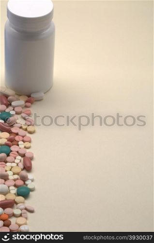 Plastic white medical bottle with vertical copy space. Plastic medical bottle on a beige background