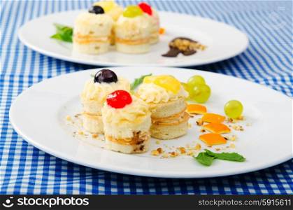 Plate full of tasty mini cakes