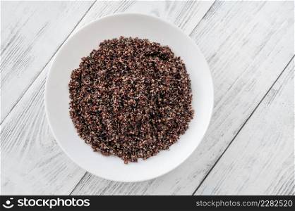Plate of Black quinoa on white table
