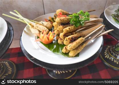 Plate of chicken and tofu satay sticks