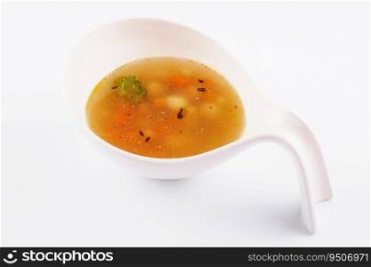 Plate of chicken soup isolated over white