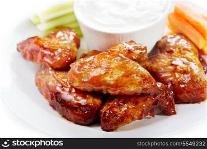 plate of chicken wings on white background