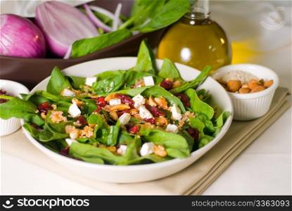 plate of fresh colorfull spinach salad close up