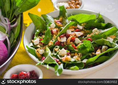 plate of fresh colorfull spinach salad close up