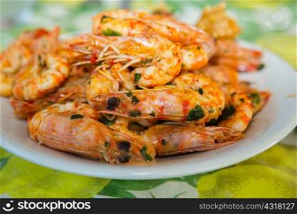 Plate of fried prawns and herbs
