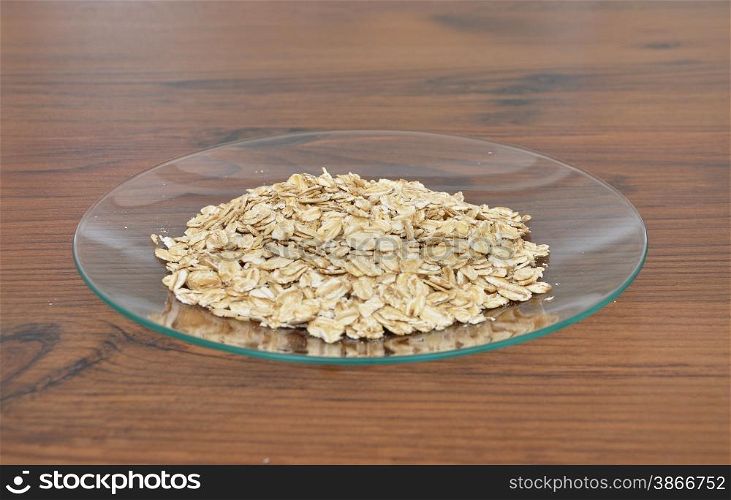 Plate of glass with oat flakes