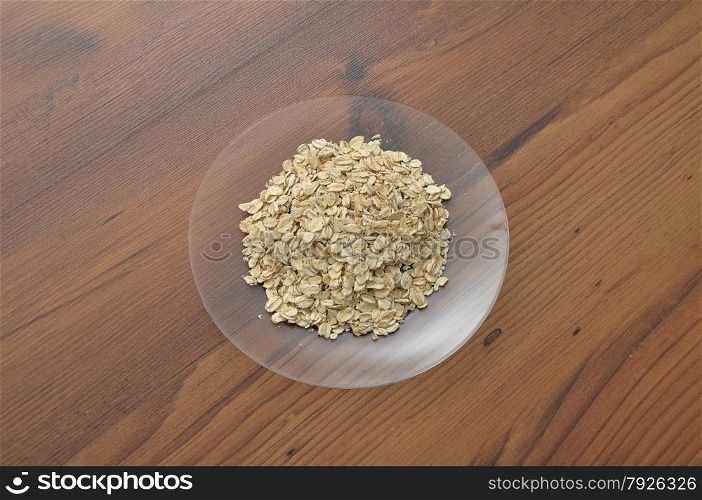Plate of glass with oat flakes
