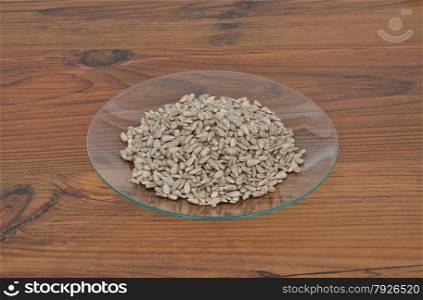 Plate of glass with sunflower nuts