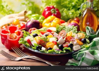 plate of greek salad on wooden table