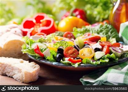plate of greek salad on wooden table