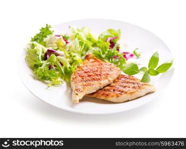 plate of grilled chicken breast with salad on white background