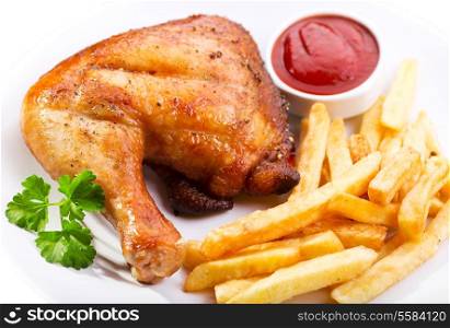 plate of grilled chicken leg with fries
